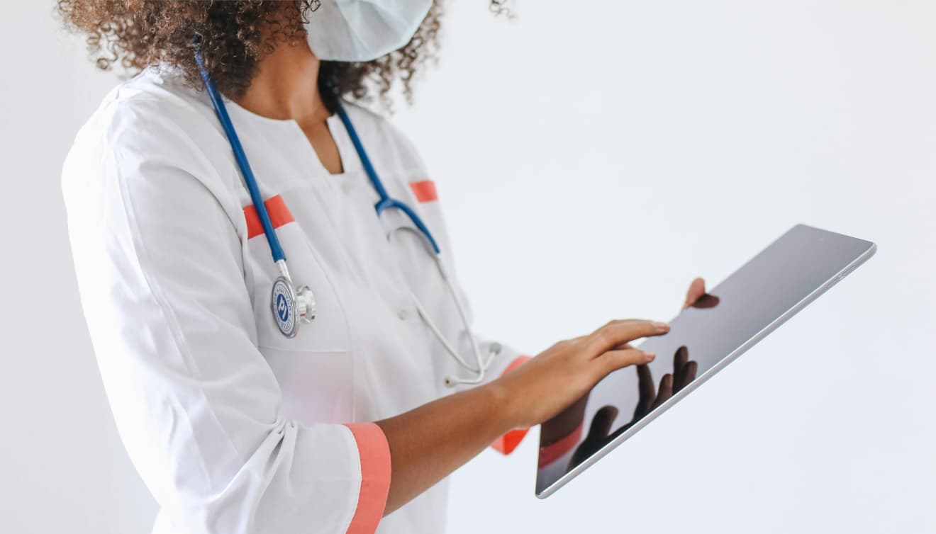 Doctor carefully looking at her tablet